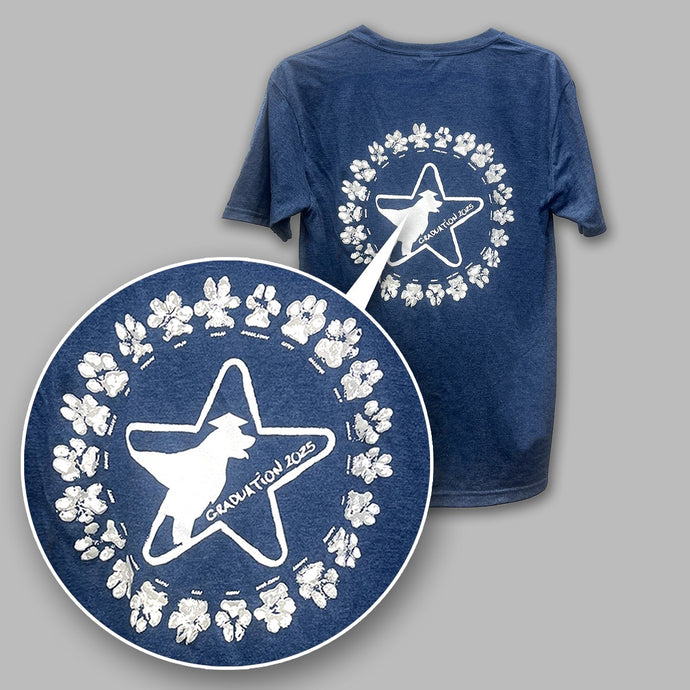 Blue t-shirt with white star and paw print design on a gray background